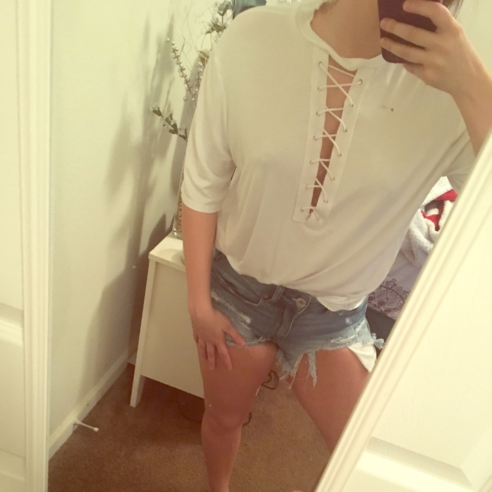 A white shirt sleeve lace up detail shirt